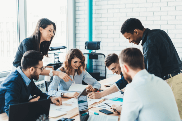 A work group collaborating on a project around a table